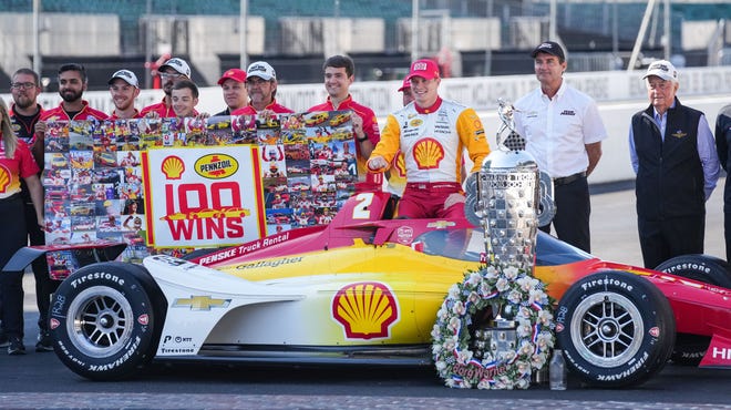 Team Penske driver Josef Newgarden (2) is photographed with the Borg-Warner Trophy after winning the 107th running of the Indianapolis 500 Monday, May 29, 2023, at Indianapolis Motor Speedway.