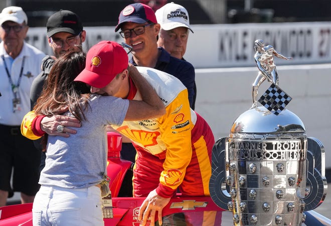 Team Penske driver Josef Newgarden (2) hugs Beth Boles after winning the 107th running of the Indianapolis 500 Monday, May 29, 2023, at Indianapolis Motor Speedway.