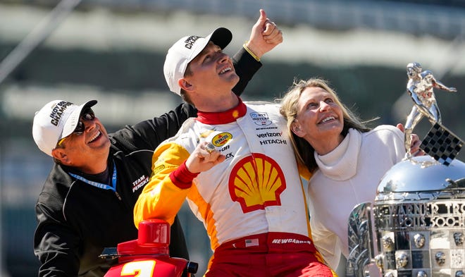 Team Penske driver Josef Newgarden (2) smiles for a photo with his parents Joey Newgarden (left) and Tina after winning the 107th running of the Indianapolis 500 Monday, May 29, 2023, at Indianapolis Motor Speedway.