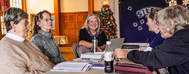 From left, Carolyn Dion, Vivian Payne-Jones, Pastor Mandie Gould-Willoughby, Mary Fatch, and Margie Reed meet up with their weekly bible study group at Mount Olive United Methodist Church (1449 S. High School Road) on Nov. 30, 2023, in Indianapolis.