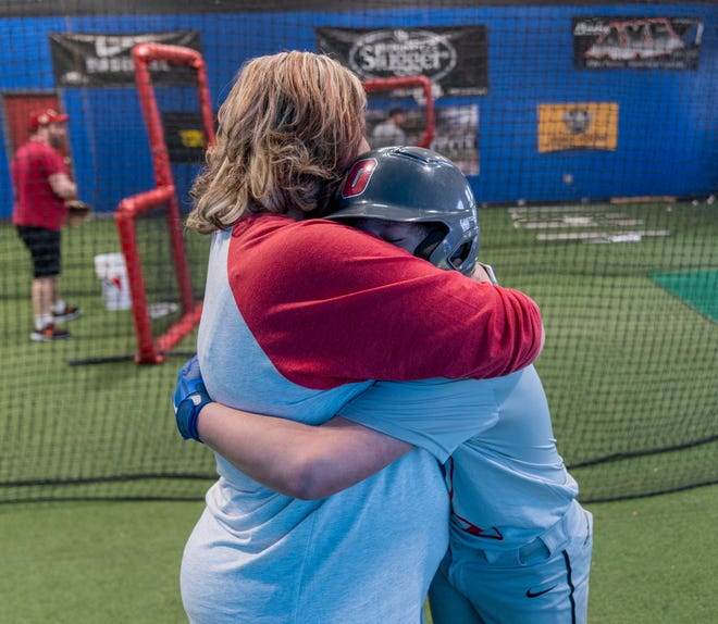 Maddox O’Connor said “I love you mom,” as he embraces Shawn O’Connor at The Strike Zone in Noblesville, Sunday, Feb. 26, 2023, during practice for their USAthletic 12U team.