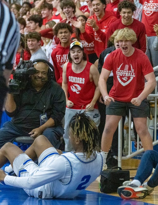 Hamilton Southeastern High School's Rephaim Stevenson (2) is mocked by Fishers High School’s students during late game action at Carmel High School, Tuesday, Feb. 28, 2023, during the Fishers boys’ sectional win over HSE, 68-49.
