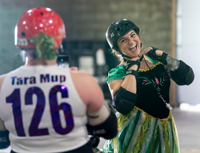 Angie Hubert, aka Bona Petite who is part of South Bend Roller Derby, shows off her Disney princess-themed costume as she officiates a roller derby game on the east side of Indianapolis on Oct. 7, 2023. Except for a break during the early Covid-19 years, this event has been held since 2008.