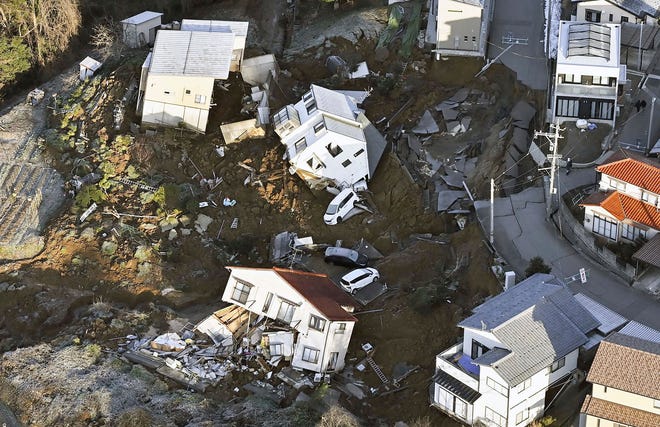 Houses fallen by an earthquake are seen in Kanazawa, Ishikawa prefecture, Japan Tuesday, Jan. 2, 2024.