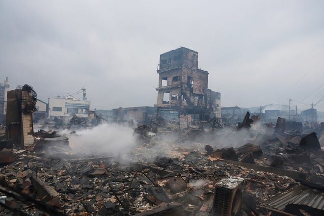 This general view shows an area devastated by a quake-induced fire in the city of Wajima, Ishikawa prefecture, on Jan. 3, 2024, after a major 7.5 magnitude earthquake struck the Noto region in Ishikawa prefecture on New Year's Day. Japanese rescuers scrambled to search for survivors on Jan. 3 as authorities warned of landslides and heavy rain after a powerful earthquake that killed at least 62 people.
