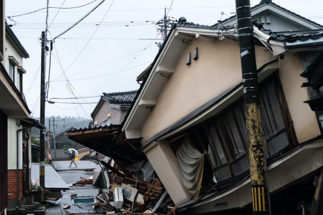 A collapsed house is seen following an earthquake on Jan. 3, 2024, in Anamizu, Japan. A series of major earthquakes have reportedly killed at least 48 people, injured dozens more, and destroyed a large amount of homes. The earthquakes, the biggest measuring 7.1 magnitude, hit the areas around Ishikawa, Toyama, and Niigata in central Japan on Monday.