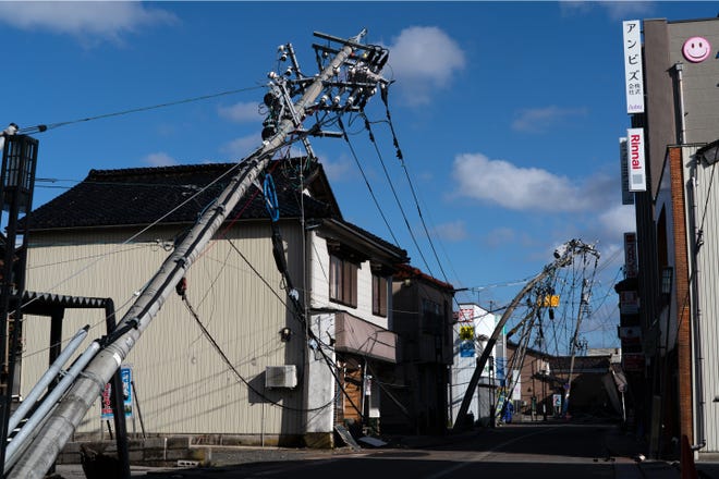 Utility workers fix an electricity pole in the aftermath of an earthquake on New Year's Day on Jan. 4, 2024, in Suzu, Japan. A series of major earthquakes have reportedly killed at least 78 people, injured dozens more, and destroyed a large amount of homes. The earthquakes, the biggest measuring 7.1 magnitude, hit the areas around Ishikawa, Toyama, and Niigata in central Japan on Monday.