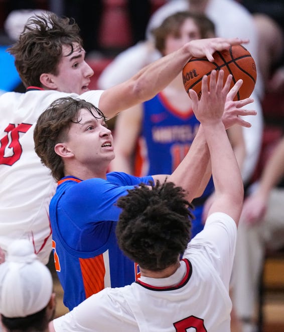 Whiteland's Gavin Stubbe (25) shot is blocked by Center Grove Trojans Joey Schmitz (15) on Saturday, Jan. 13, 2024, during the Johnson County finals at Center Grove High School in Greenwood. The Center Grove Trojans defeated Whiteland, 68-43.