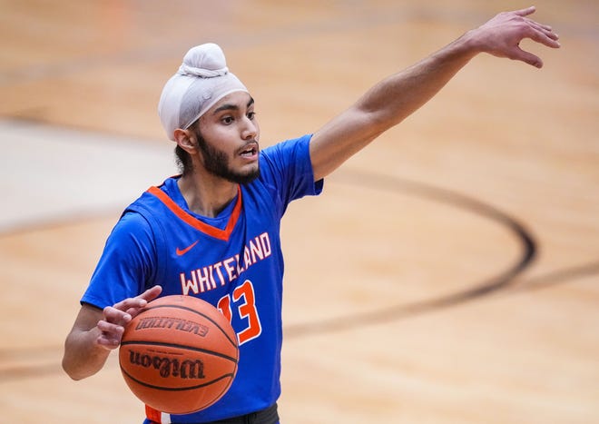 Whiteland's guard Jaskirat Banwait (13) yells to teammates Saturday, Jan. 13, 2024, during the Johnson County finals at Center Grove High School in Greenwood. The Center Grove Trojans defeated Whiteland, 68-43.