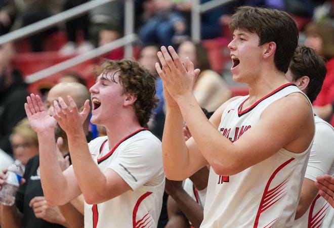 Center Grove Trojans forward Will Spellman (42) and Center Grove Trojans Dylan Meador (1) yells in excitement Saturday, Jan. 13, 2024, during the Johnson County finals at Center Grove High School in Greenwood. The Center Grove Trojans defeated Whiteland, 68-43.