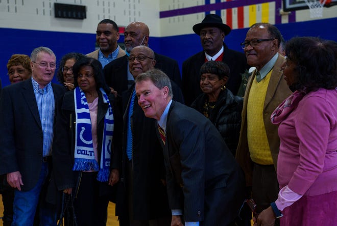 Indianapolis Mayor Joe Hogsett , Diana Strader and family, and community members present pose Monday, Jan. 15, 2024, for a photo at Stanley Strader Park Family Center after a press conference highlighting recent renovations from Citizens Energy Group’s Sharing The Dream service project and the park’s name change that was made in 2023.