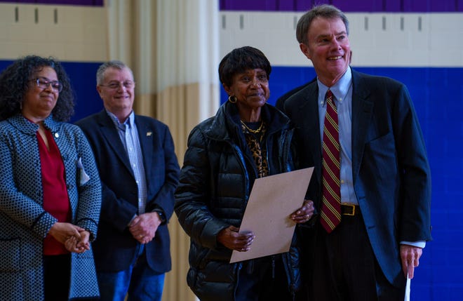 Indianapolis Mayor Joe Hogsett presents Monday, Jan. 15, 2024, a city proclamation to Diana Strader in honor of her late husband, Stanley Strader, during a press conference highlighting recent renovations from Citizens Energy Group’s Sharing The Dream service project and the park’s name change that was made in 2023. Strader was a leader and advocate for the south side of Indianapolis and served 12 years on the City County Council.