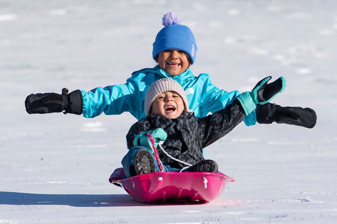 Fernanda Ruiz, 6, and Tomas Ruiz, 3, sled down a hill during the winter storms at Willamette University on Monday, Jan. 15, 2024, in Salem, Ore.