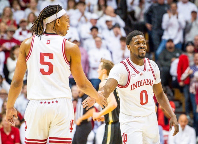 Indiana's Xavier Johnson (0) and Malik Reneau (5) slap hands during the first half of the Indiana versus Purdue men's basketball game at Simon Skjodt Assembly Hall on Tuesday, Jan. 16, 2024.