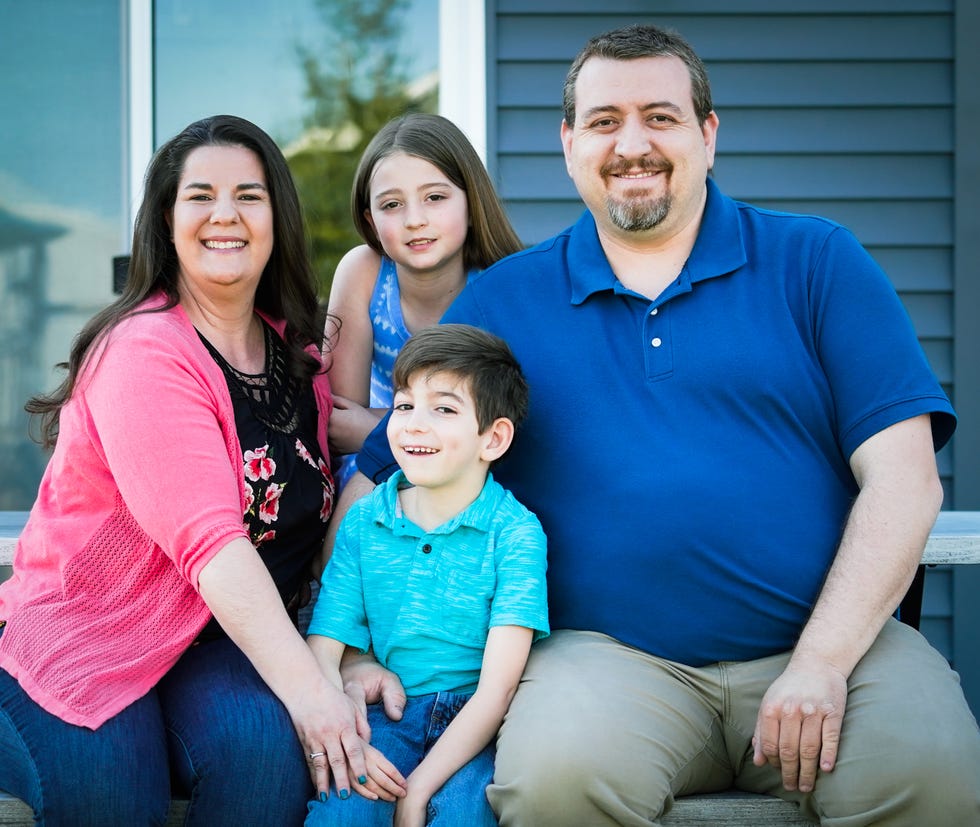 The Harris family, which includes Ryder Harris, center, who has a lifelong disorder called Polymicrogyria (PMG,) and epilepsy, at their Indiana home on Thursday, April 13, 2023. The Harris family hopes a service dog would help to predict Ryder's seizures. The Harris family from left, Allison, Kennedy, Ryder, and Chris Harris.